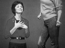Laverne dancing to a record, while Shirley gleefully embraces an album; Color